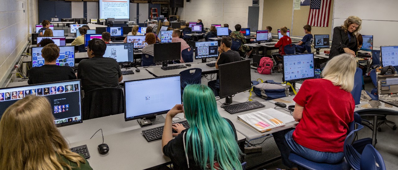 Rows of computers and students in a Digital Media class.